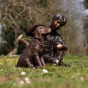Bronzeskulptur "Junge Tobi mit Hund"
