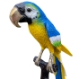 Bronzeskulptur "Papagei auf Ast, gelb-blau"