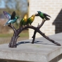 Bronzeskulptur "Vier Vögel auf einem Zweig