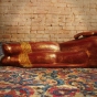 Buddhafigur liegend von hinten aus Holz