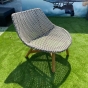 DEDON MBRACE Club chair in pepper von der Seite