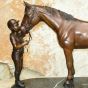 Bronzeskulptur Junge mit Pferd stehend 