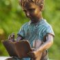 Bronzeskulptur Junge mit Buch 