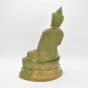 Sitzender Buddha aus Messing mit grüner Patina auf einem Sockel